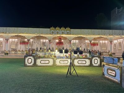 Lit buffet counters facing the lawn at Dharam Vatika wedding venue, Sohna Gurgaon